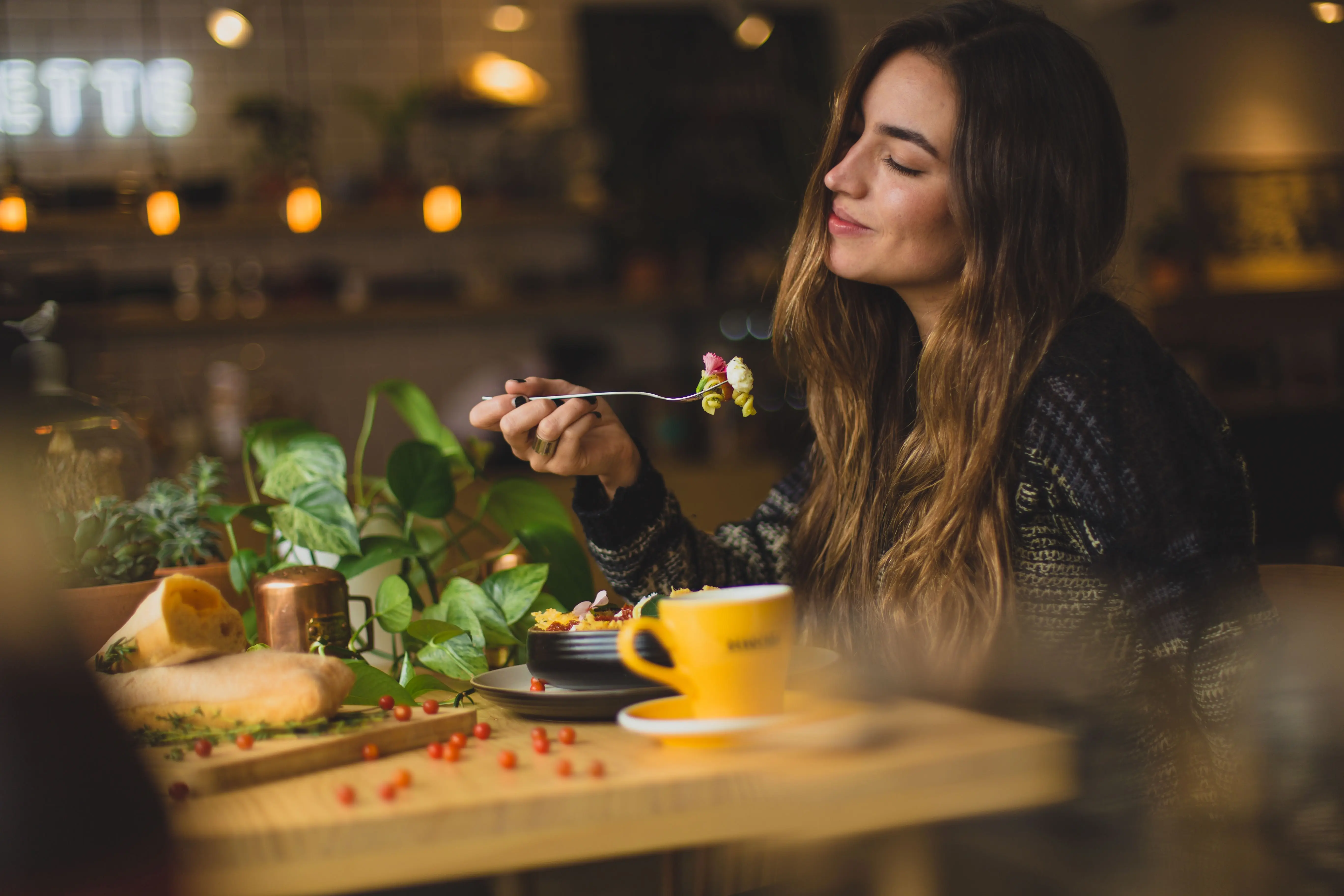 woman enjoying food, meals in storage container and food bowls in a bowl